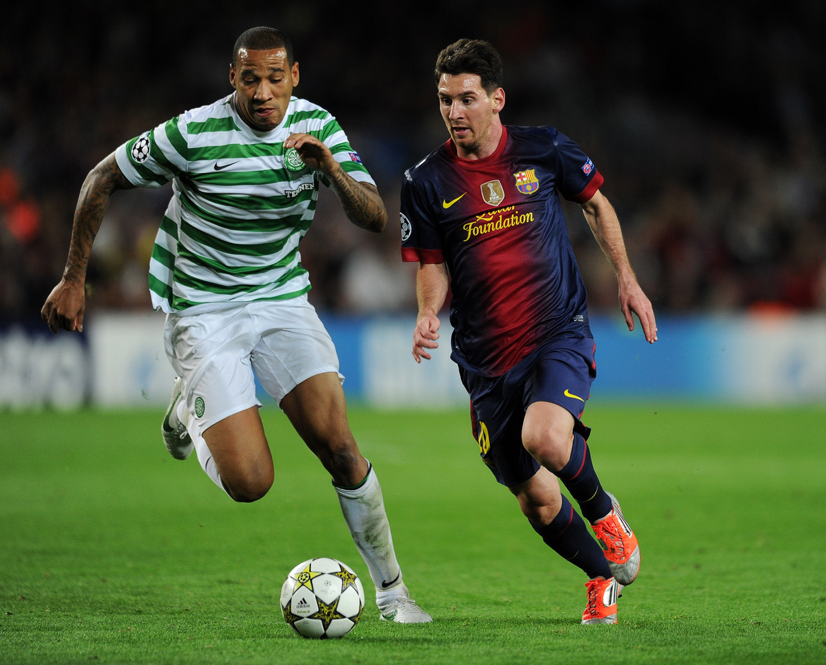 Lionel Messi with Kelvin Wilson