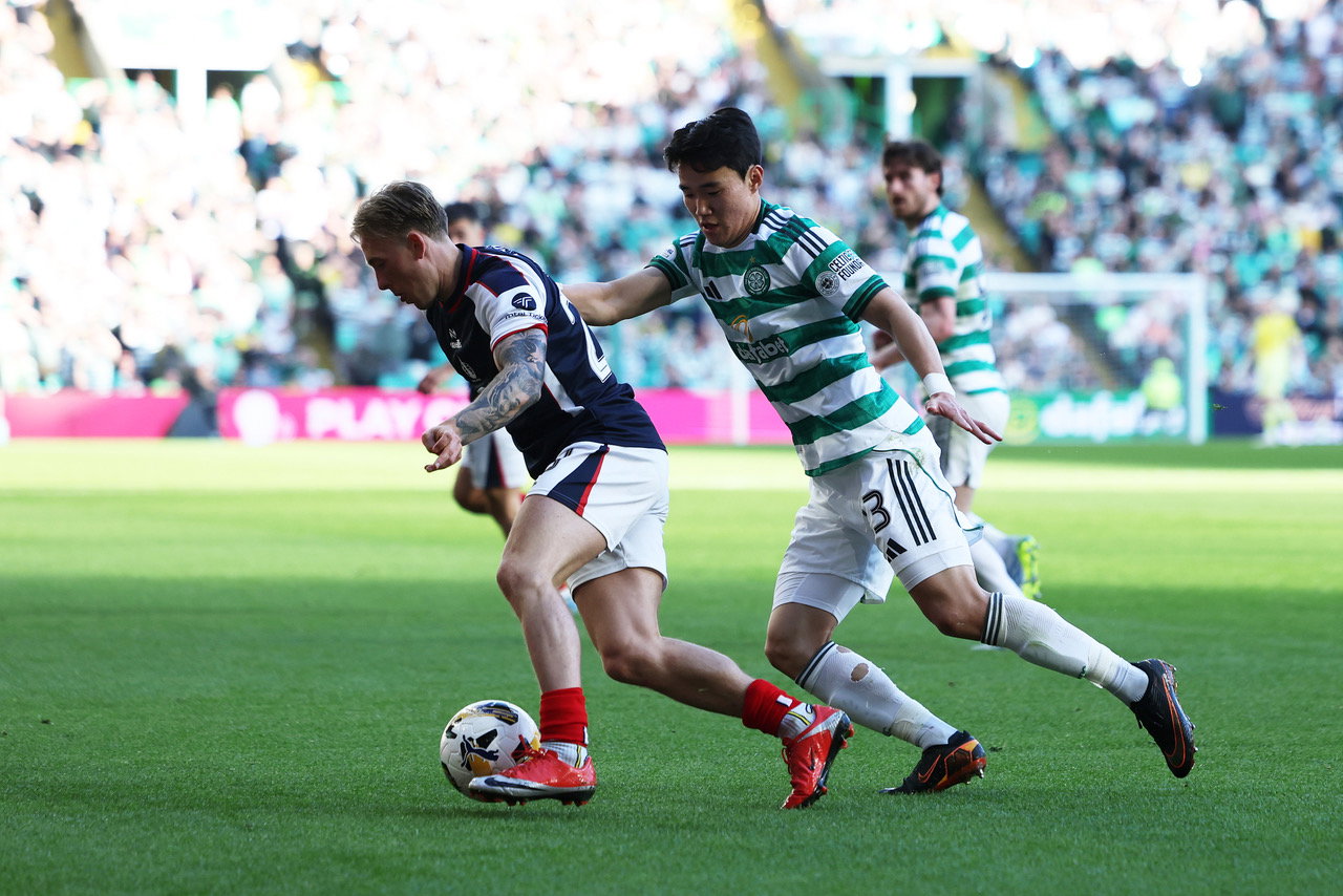 Calvin Miller of Falkirk is challenged by Yang Hyun-Jun of Celtic