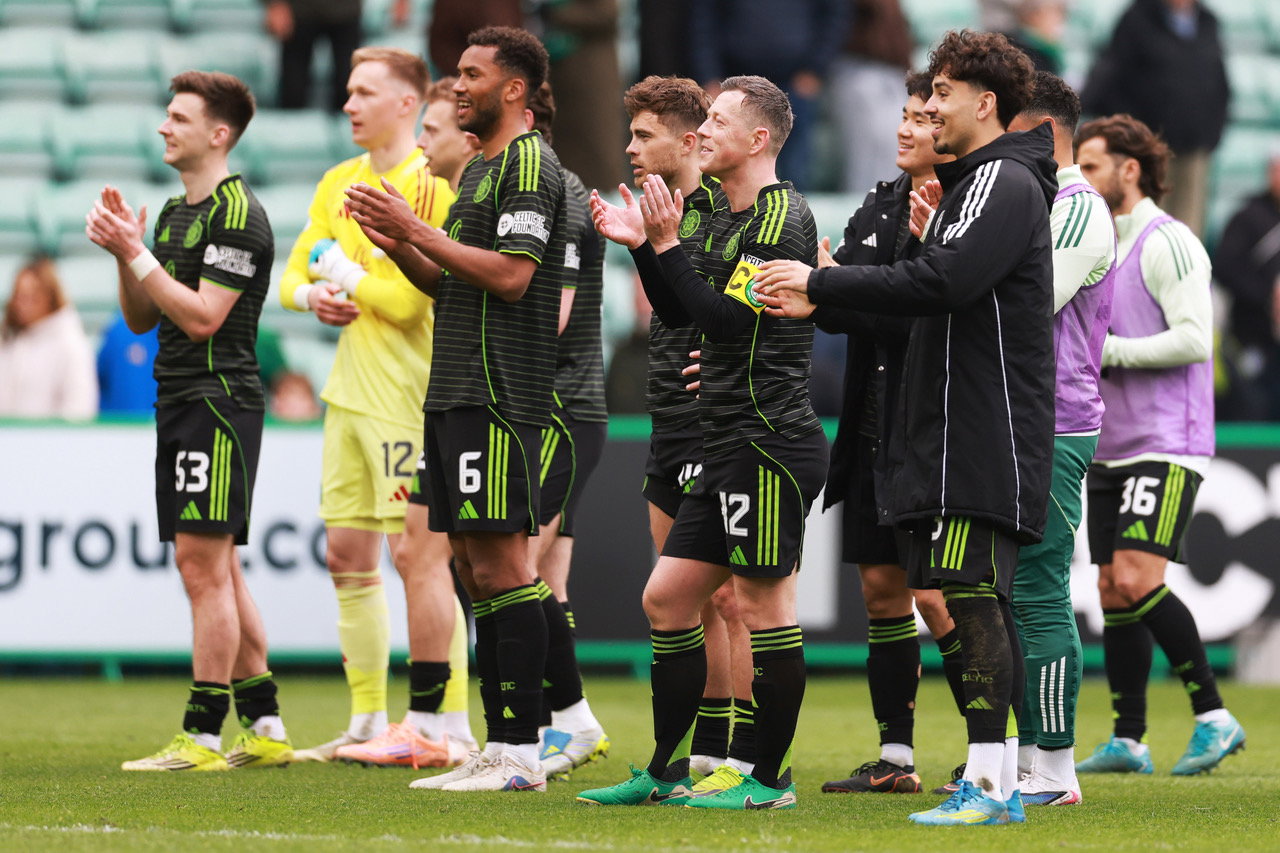 Celtic players applaud the fans after the win at Easter Road