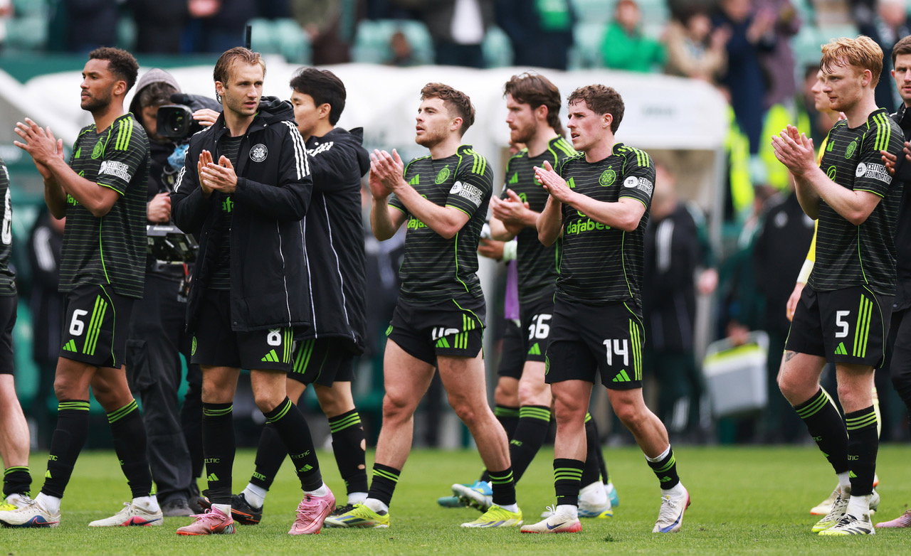 Celtic players applaud the fans after the win at Easter Road